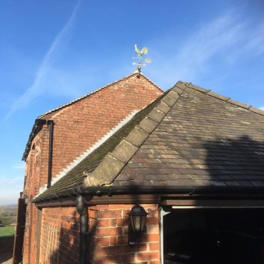 weathercock_weathervane_installed_on_a_barn_in_the_countryside